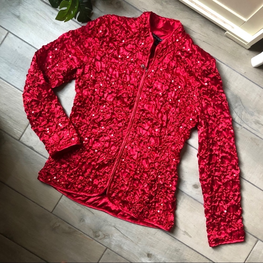 Adressing woman smocked crinkle sequin mock neck jacket in vibrant red. Size L